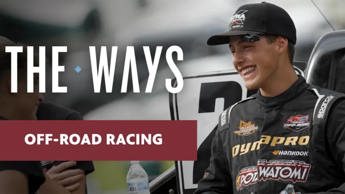 Hunter VanZile wearing a dark shirt with racing logos and a dark trucker-style baseball cap, standing in front of his off-road racing vehicle, with the resource title superimposed, The Ways, and the story title also superimposed, Off-Road Racing