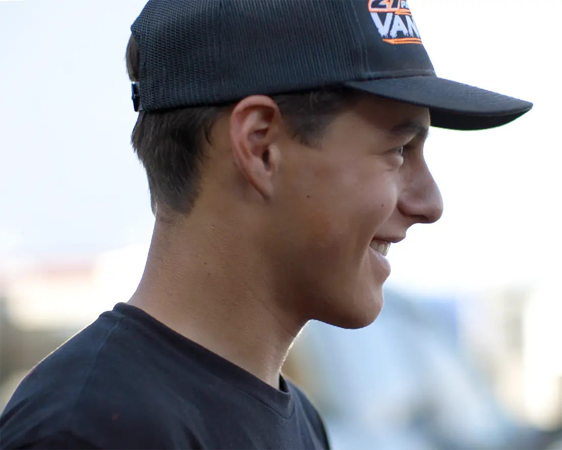 Hunter VanZile wearing a dark shirt and a dark trucker-style baseball cap