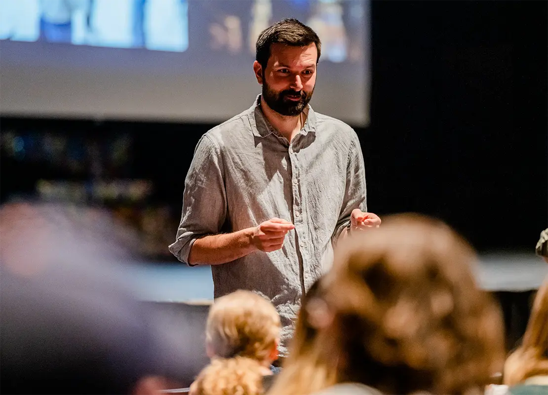 PBS Wisconsin's Nick Ostrem speaking in front of a group of people