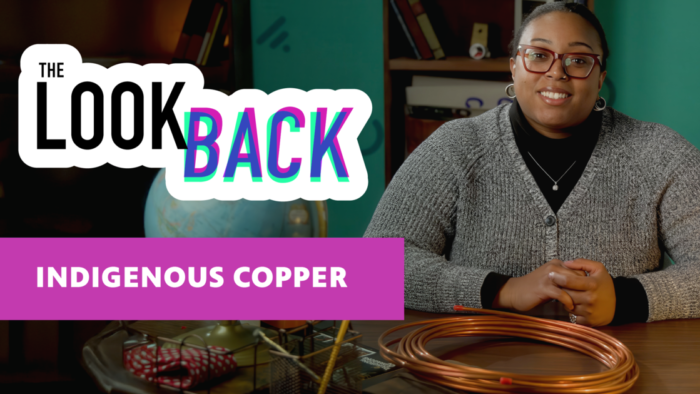 The Look Back logo with "Indigenous Copper" text beside host seated with copper tubing at a desk