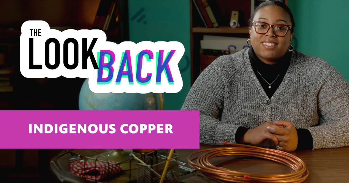 The Look Back logo with "Indigenous Copper" text beside host seated with copper tubing at a desk